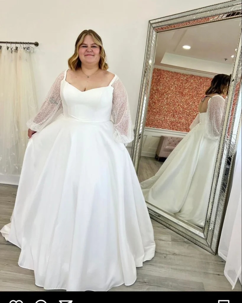 Elegant White Gown with Sheer Sleeves