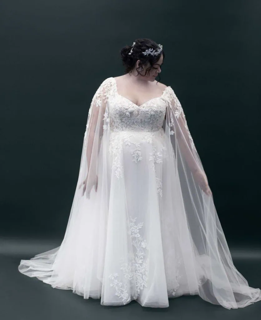 Elegant Lace Gown with Flowing Cape