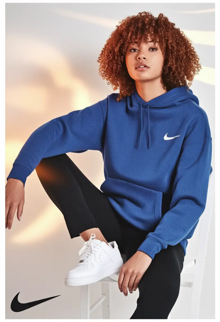 Bright blue hoodie paired with black leggings and white sneakers for a sporty, everyday school outfit