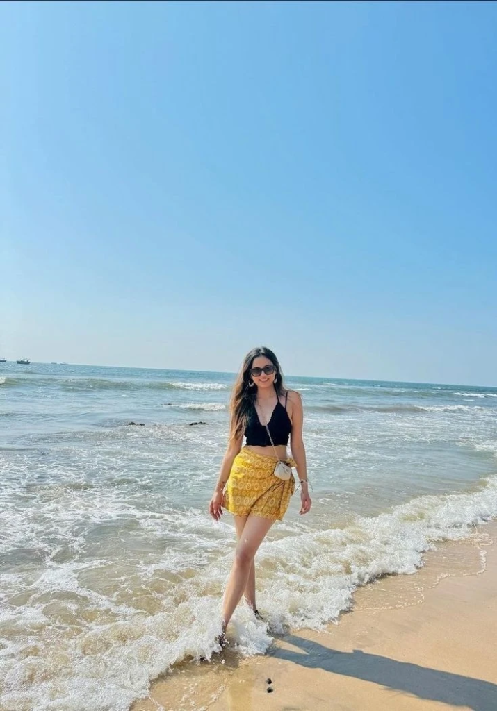 black bikini top with yellow wrap skirt beach outfit