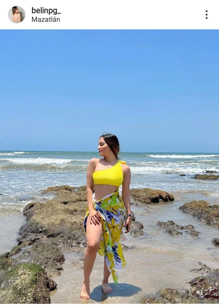bright crop top with patterned sarong beach outfit