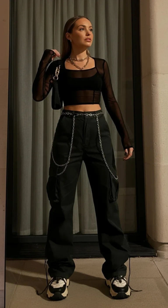Mesh top layered over bandeau with cargo pants styled for summer concerts featuring breathable, edgy festival fashion.