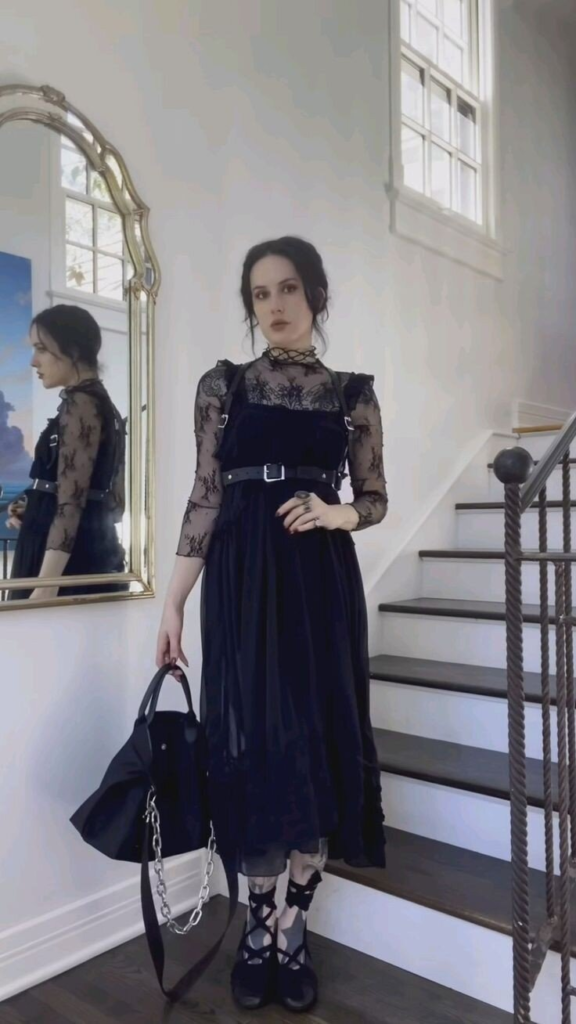 Black velvet midi dress with lace sleeves, high neckline, and black platform boots in a romantic boho goth outfit